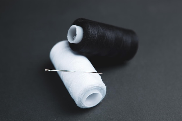 Black and white thread on the table