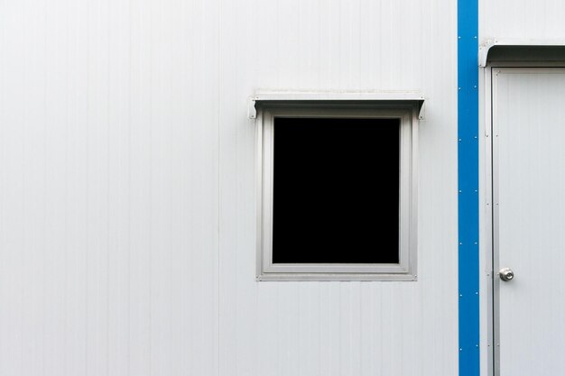 Black window and door decorated of white container house