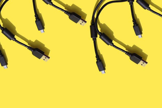 black wires for gadgets on a yellow background