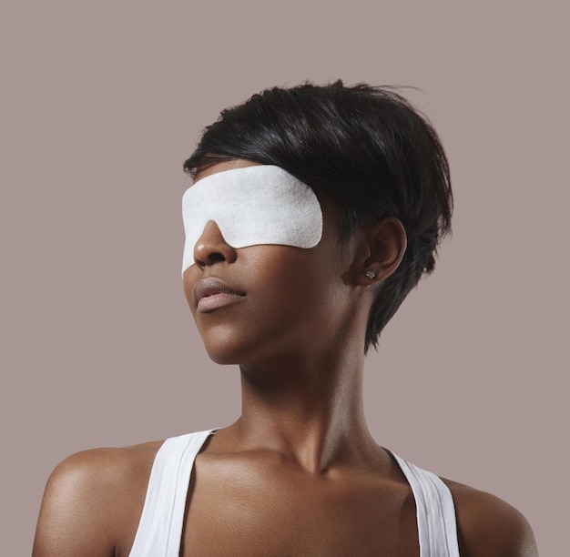 Black woman fith a facial eye mask