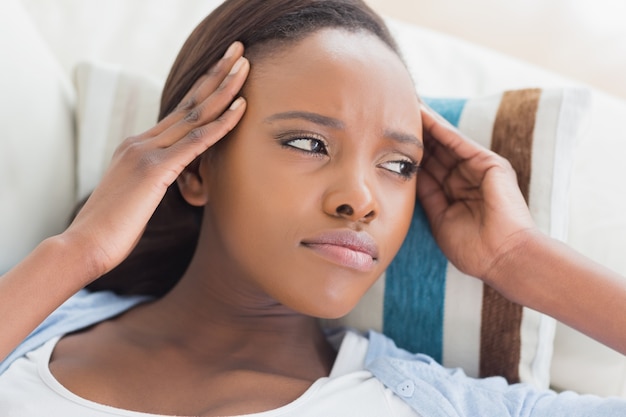 Black woman having pains on the head