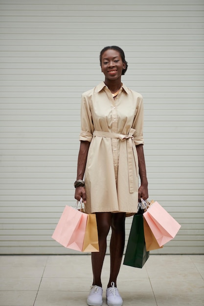 Black Woman Holding Many PaperBags