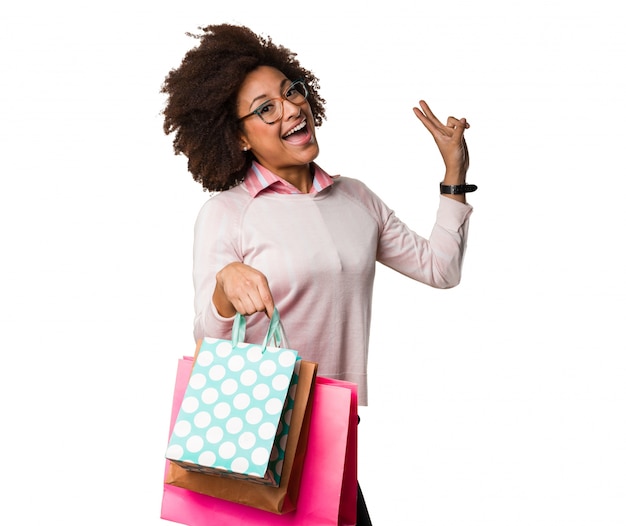 black woman holding shopping bags