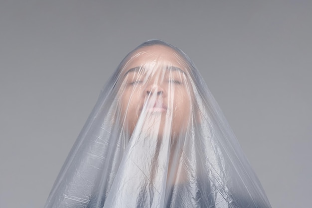 black woman in plastic bag