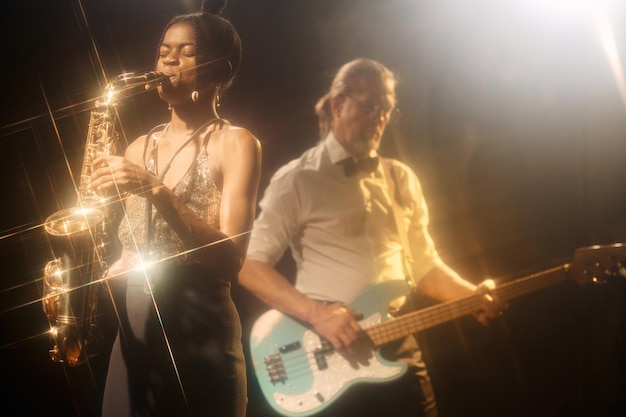 Black woman playing saxophone with jazz band