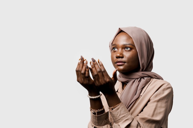 Black woman pray in god. Religious girl. Islamic religion