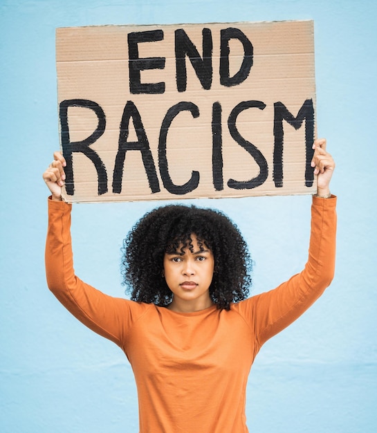 black woman protest poster and angry at racism fight for equality human rights and freedom isolated on blue background global problem social justice and revolution anger in studio and politics