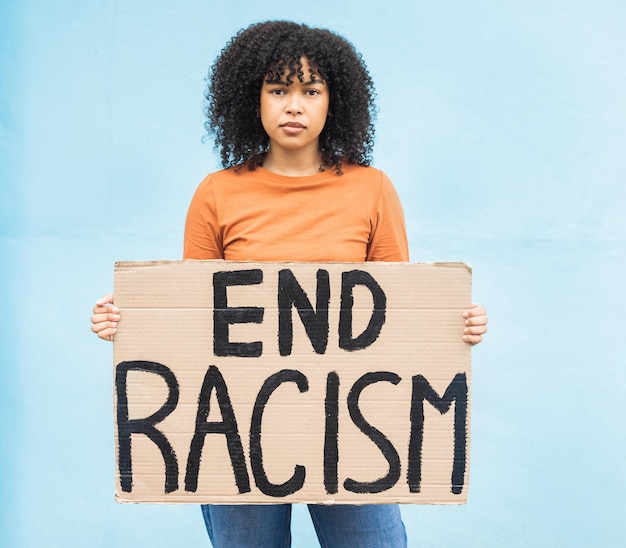 Photo black woman protest sign and anger in portrait racism and equality human rights and freedom isolated on blue background global problem social justice and revolution angry in studio and politics