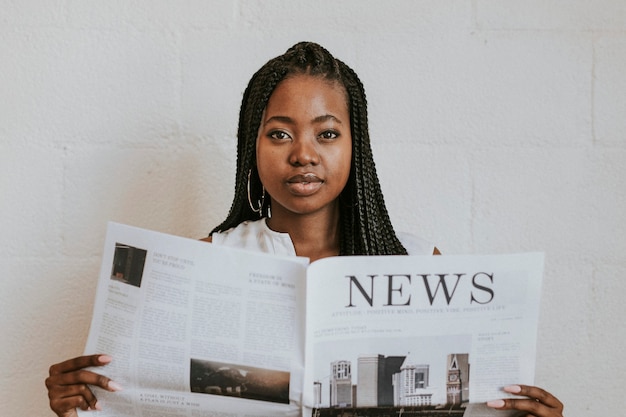 Black woman reading a newspaper