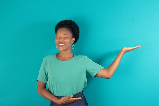 Black woman smiling with a green background