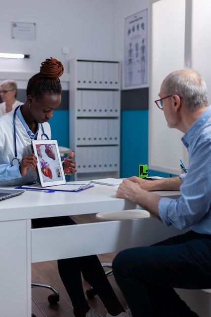 Black woman with doctor profession showing organs illustration