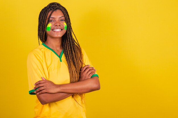 Black woman young brazilian soccer fan arms crossed confident\
happy joyful