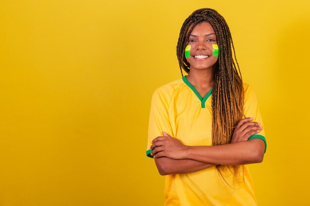 Black woman young brazilian soccer fan arms crossed confident happy joyful