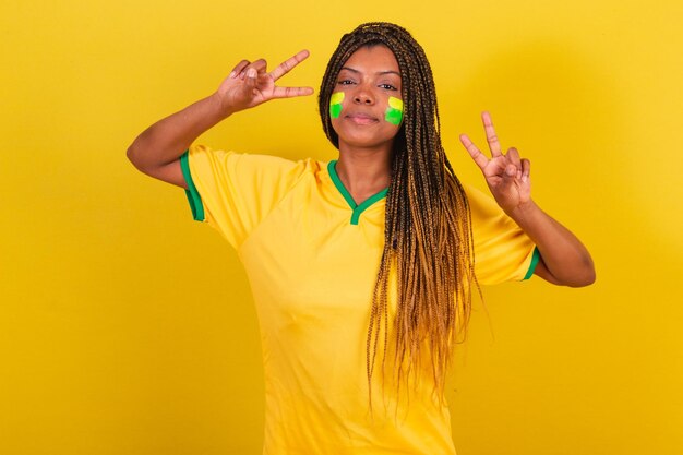 Black woman young brazilian soccer fan posing for selfie peace\
and love brazil soccer team
