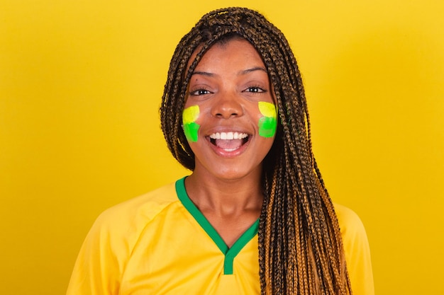 Black woman young brazilian soccer fan smiling joyful closeup\
photo soccer brazil