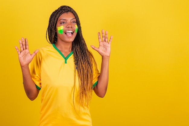 Black woman young brazilian soccer fan surprised wow\
incredible