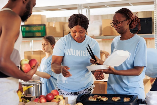 Black women providing free food to needy