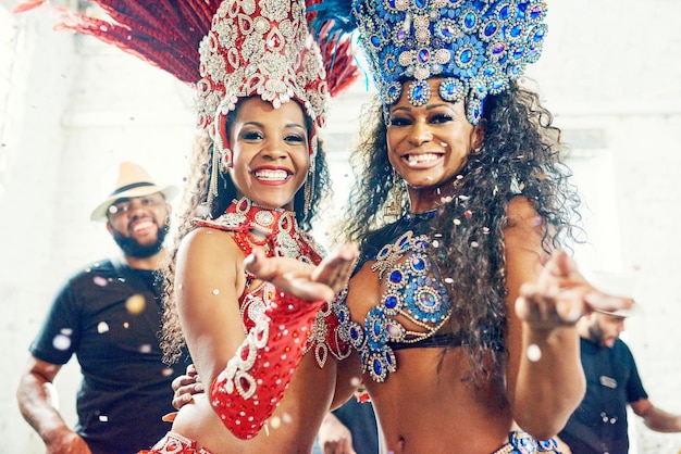 Black women samba dance and carnival party in Brazil for dancing festival music event show and crazy new year celebration Rio De Janeiro happy face smile and portrait of latin Brazilian culture