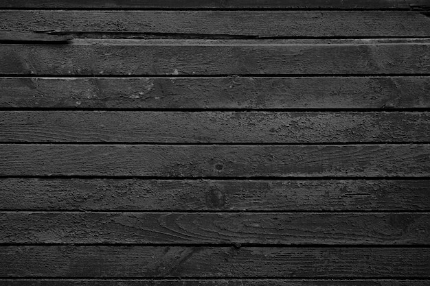 Black wooden background. Dark wallpaper. Blackboard