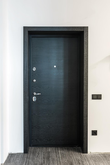 Black wooden door in dark style color for modern interior and apartments flat or office