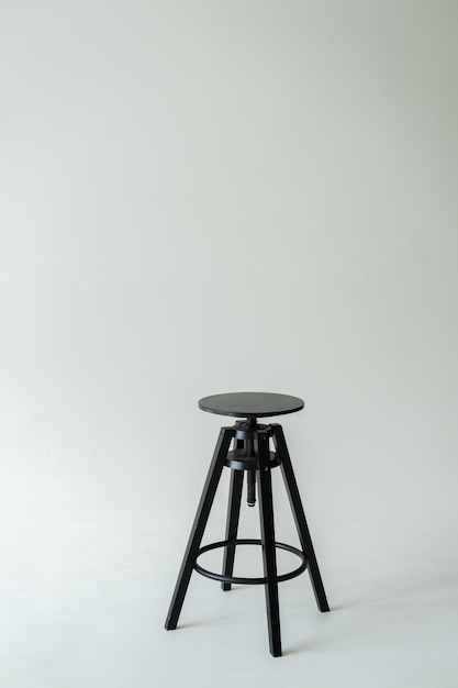 Black wooden stool on a white background High quality photo