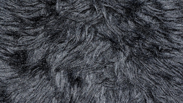 Black wool rug texture background