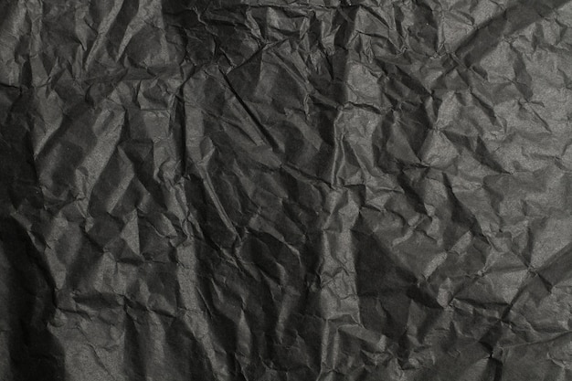 Black wrinkled paper in a close up view