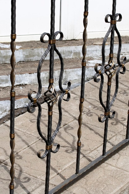 Black and yellow patterned wrought iron fence