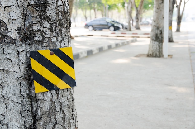 Black and Yellow Striped Sign