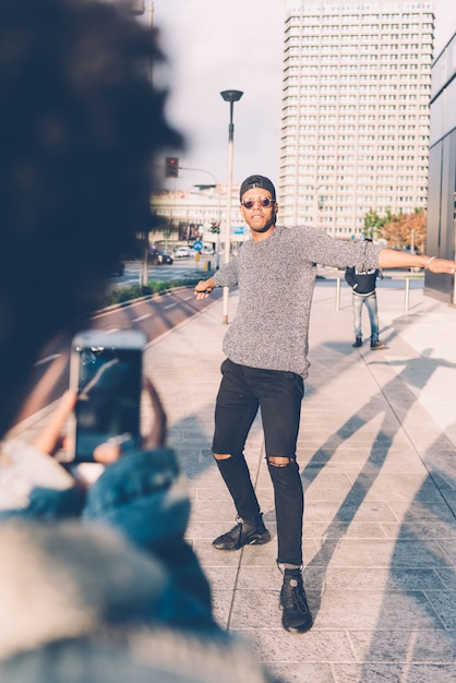 Black young couple taking pictures