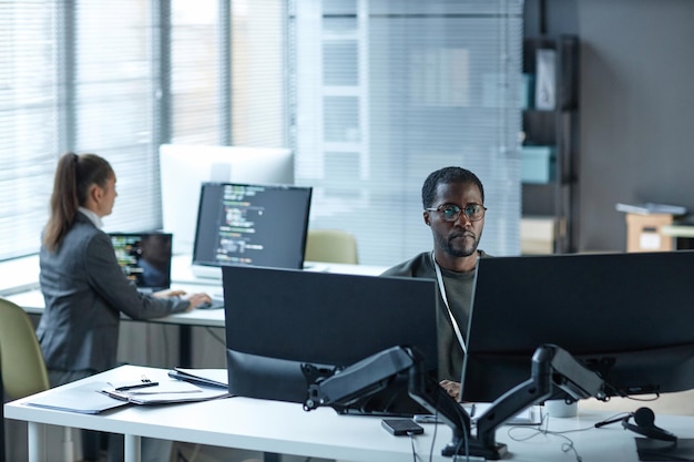 Black young man as it programmer