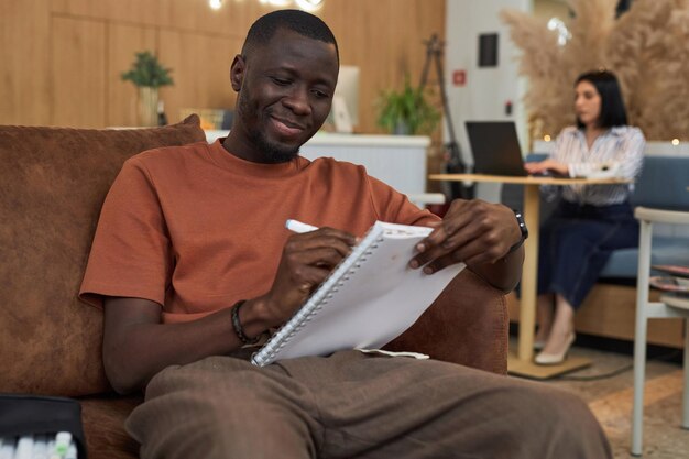 Black young man sketching