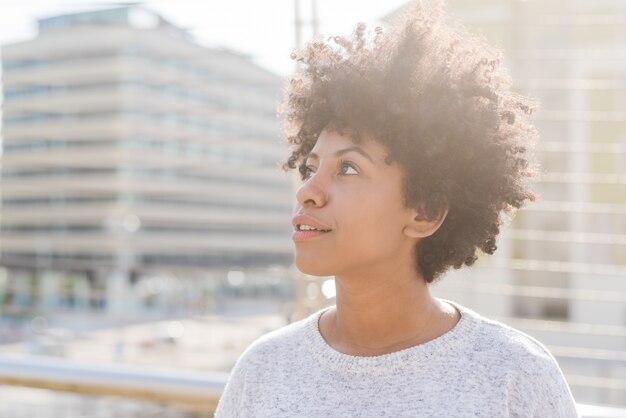 Black young woman posing at the camera