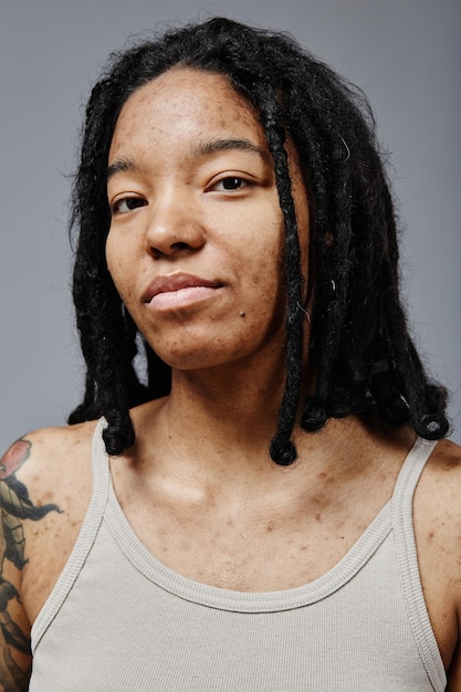 Black young woman with no makeup and real skin texture