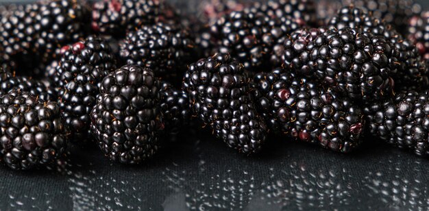 Blackberries on a black glass background