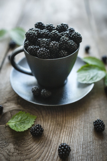 Blackberries, fresh berries, wooden background, vegetarian food