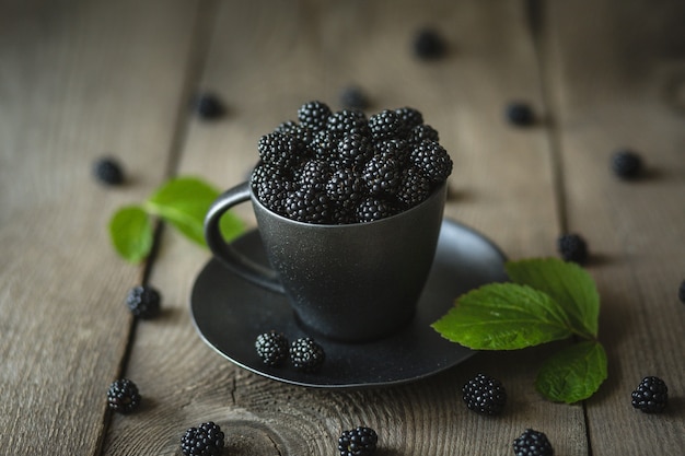 Blackberries, fresh berries, wooden background, vegetarian food