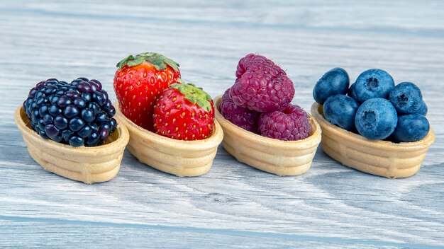 Blackberries, raspberries, strawberries, blueberries in a waffle basket