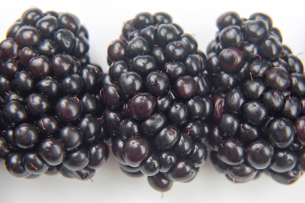 Blackberries on white background. useful vitamin healthy food fruit. healthy vegetable breakfast
