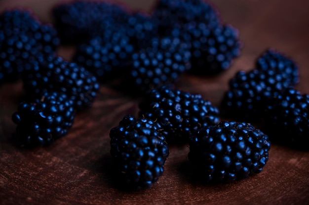 The blackberry is on the plate. Cherine berries