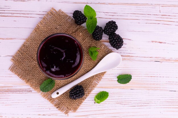 Blackberry jam in a bowl flat lay