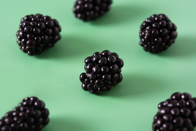 Blackberry pattern on green background