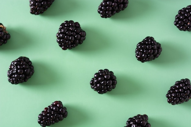 Photo blackberry pattern on green background