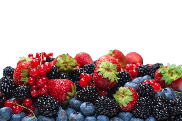 Blackberry, raspberry, blueberry,  red currant isolated on a white background. Top view.