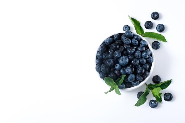 blackberry on white table and mint, view from above,