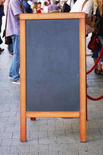 Photo blackboard on sidewalk in city