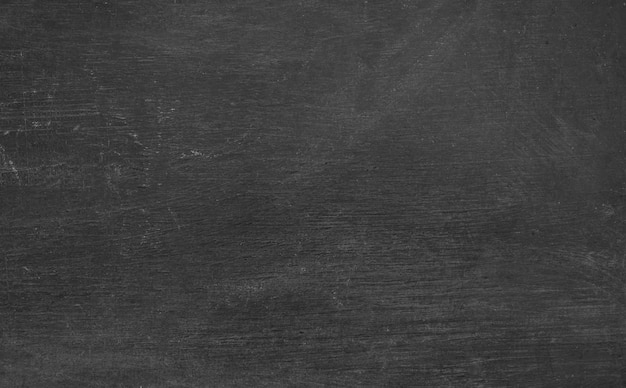 Photo blackboard with chalk dust particle on textured. blank chalkboard background for classroom, education and design concept.