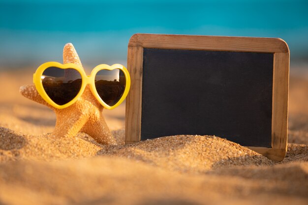 Blackboard with copy space on the beach