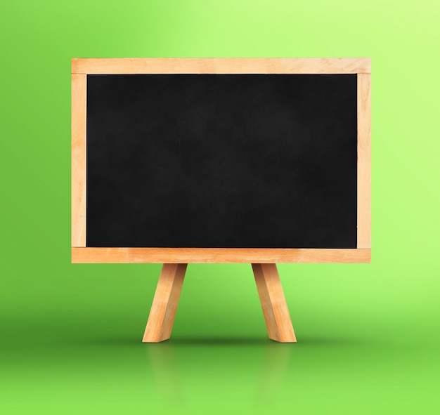 Photo blackboard with easel on vivid green studio backdrop