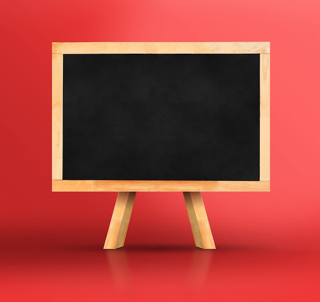 Blackboard with easel on vivid red studio backdrop